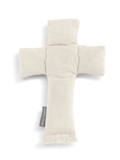 Cross-shaped pillow with frayed edges on a white background