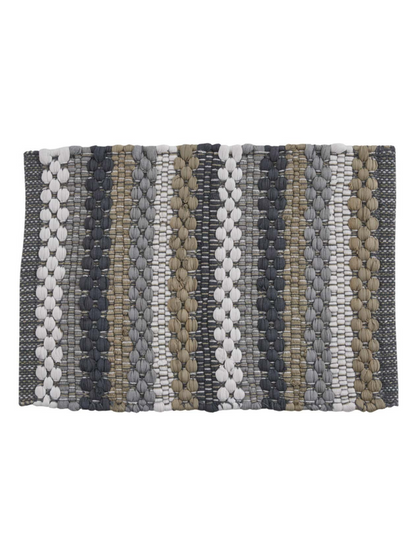 A rectangular woven placemat with vertical stripes in gray, beige, and white, featuring a textured braided pattern, shown on a plain white background.