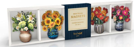 A decorative floral magnet set displayed on a white shelf. The set includes four square magnets in vases with green, yellow, orange, and pink flowers, alongside a dark blue book-style cover labeled 'MAGNETS'.