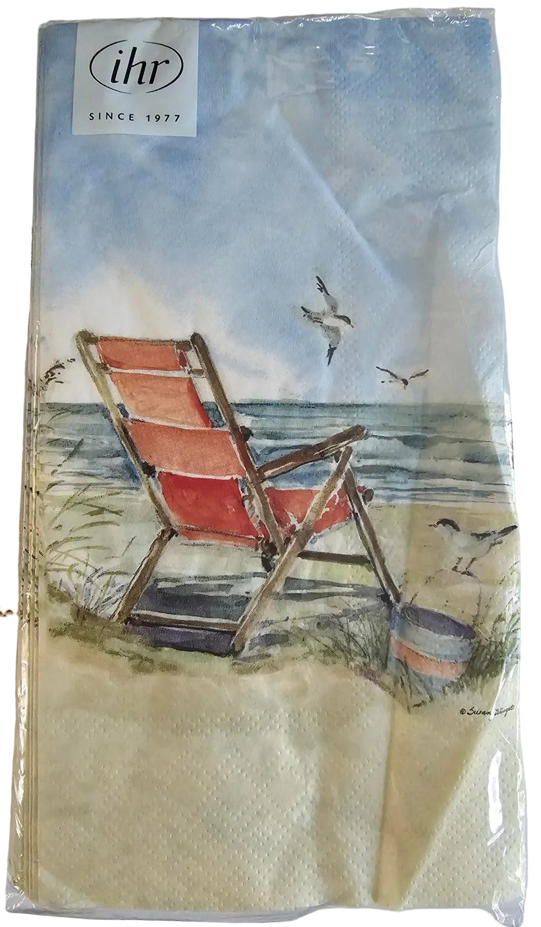 A packaged paper napkin featuring a printed illustration of a red beach chair by a lake with birds and a blue sky, with a visible 'libi' logo on the top right.