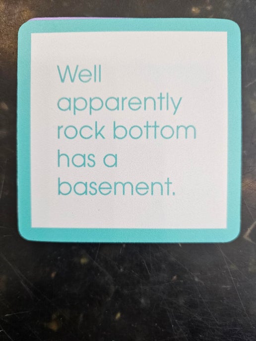 1056- "Rock Bottom"  Drinks On Me Coaster 