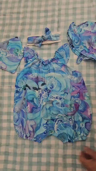 video of toddler romper and accessories in blue 