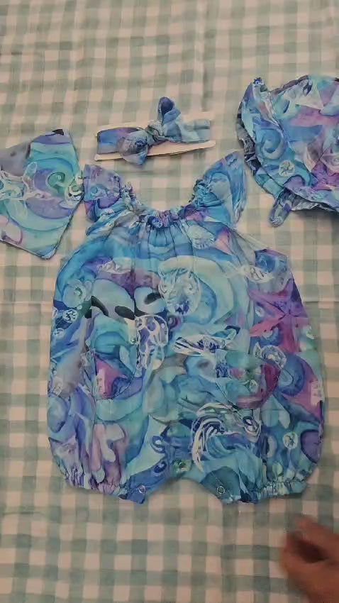 video of toddler romper and accessories in blue 